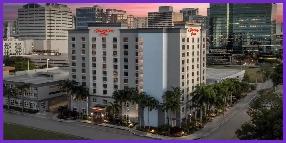 Hampton-Inn-Exterior-1000x500-purple-border